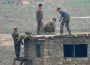 ＜Super-telephoto Lens Report＞North Korea's Flood Recovery Site (3) Young Soldiers Working Silently in Pouring Rain, Seemingly Driven by 'Do-or-Die Implementation' Slogan (10 Photos)